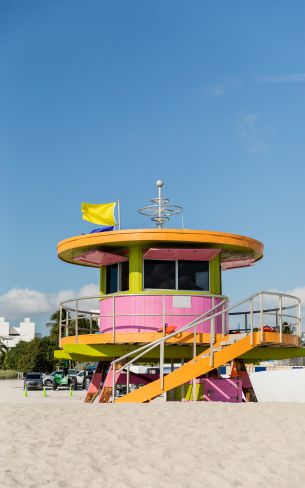 colorful-beach-lifeguard-tower-with-flags-on-top-o
